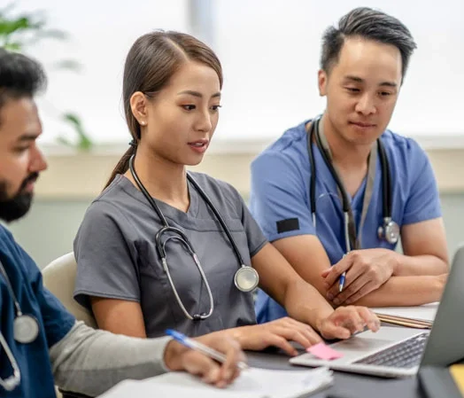 Medical professionals on computer